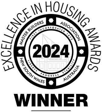 Black and white circular badge reading Excellence in Housing Awards, Master Builders Association, New South Wales Australia, 2024 Winner, with a building outline in the center.
